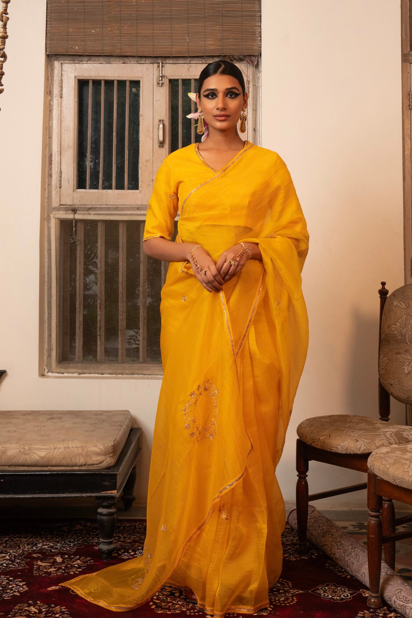 Shop Zebein’s Women’s Organza Silk Gajra Saree in Kesariya Peela, thoughtfully crafted in luxurious organza silk with a graceful drape and refined detailing. Designed for festive celebrations, wedding occasions, and elevated ethnic styling, this timeless saree blends lightweight elegance, sophisticated craftsmanship, and contemporary tradition for effortless statement dressing.