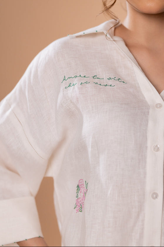 Women’s off-white 100% pure linen oversized backloop shirt with scattered hand embroidery, wide sleeves, button-down front, and relaxed summer silhouette.