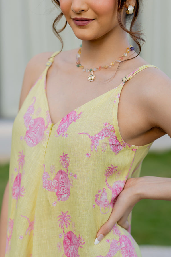 Model wearing Zebein’s Women’s 100% Pure Linen Strap Jumpsuit in yellow and pink print, featuring a relaxed silhouette, breathable sustainable linen fabric, functional pockets, and an effortlessly elegant contemporary style.