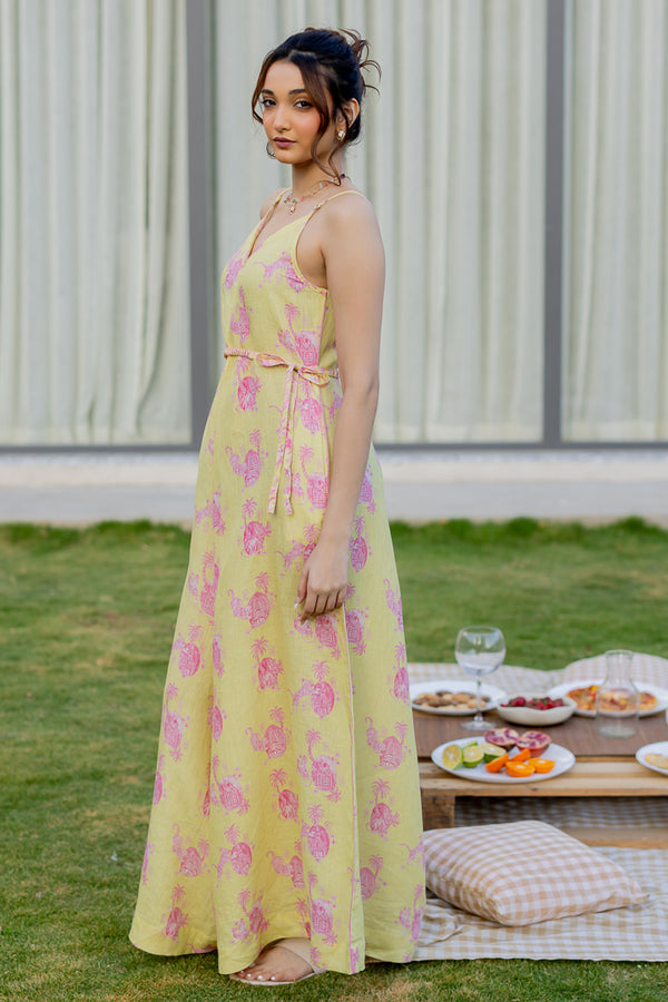 Model wearing Zebein’s Women’s 100% Pure Linen Strap Jumpsuit in yellow and pink print, featuring a relaxed silhouette, breathable sustainable linen fabric, functional pockets, and an effortlessly elegant contemporary style.