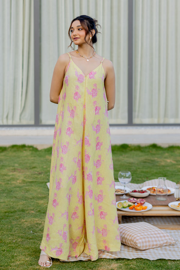 Model wearing Zebein’s Women’s 100% Pure Linen Strap Jumpsuit in yellow and pink print, featuring a relaxed silhouette, breathable sustainable linen fabric, functional pockets, and an effortlessly elegant contemporary style.