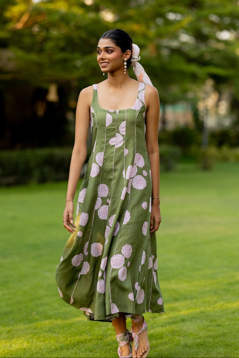 Woman wearing green floral 100% pure linen panel dress with relaxed flared silhouette by Zebein India